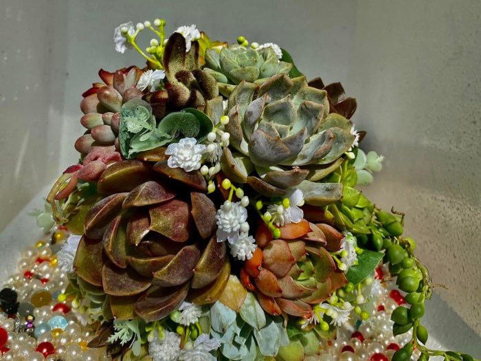 A romantic blend of succulents and white roses, creating a timeless bridal bouquet. Source_ Succulents and Cactus Vietnam Facebook Group