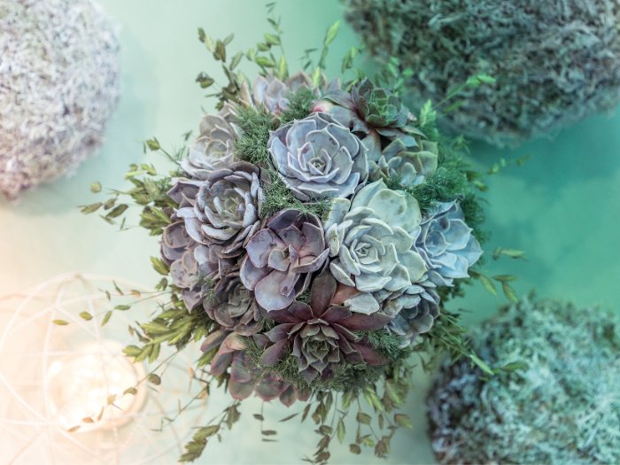 A rustic yet chic bouquet, combining the charm of succulents with lavender and eucalyptus, perfect for a garden wedding